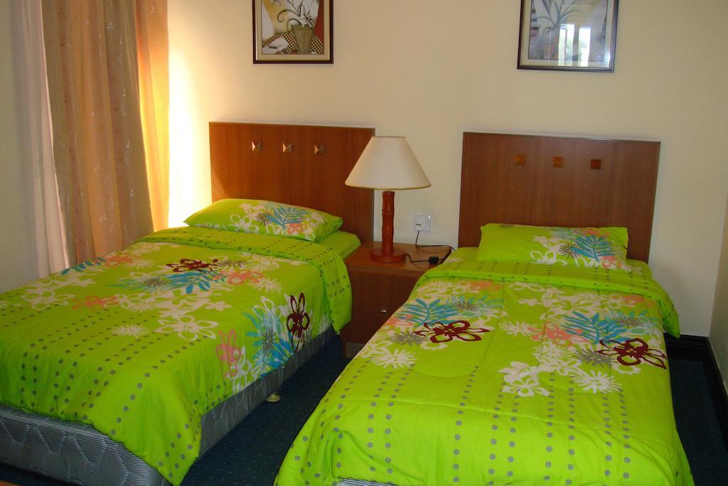 Dorcas Service Apartment - Marina Court Kota Kinabalu Quarto foto